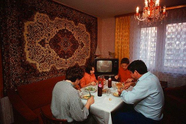 5. Family dinner against a rug view.