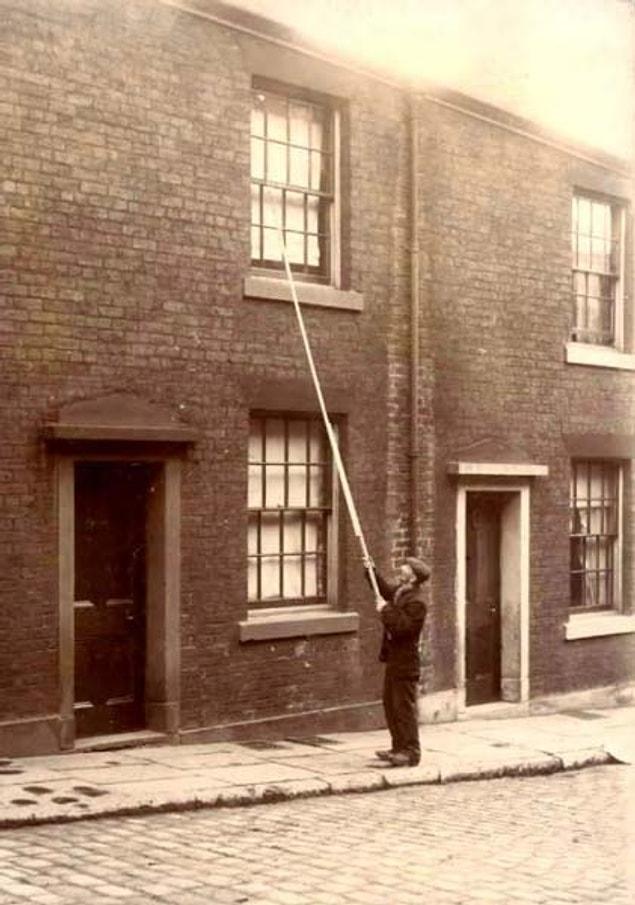 13. Before alarm-clocks were invented, there used to be "Knocker-Ups" who were paid to wake up their clients by knocking on their windows with a long stick.