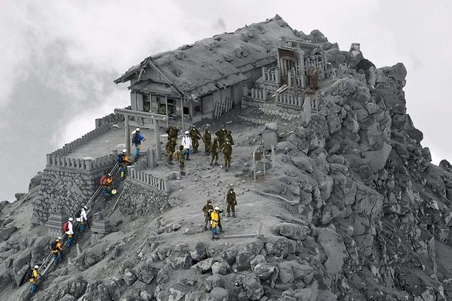 14. A temple covered with ash after a volcanic eruption in Japan