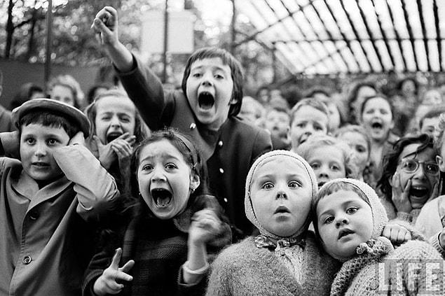 11. Terror: The children who are watching the St. George and the Dragon Story in a puppet show in Paris, 1963.