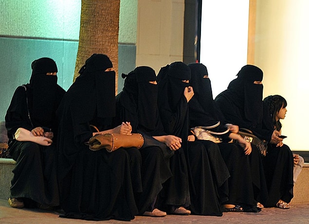 These women have to wear a special dress called a burqa, which covers the body from head to toe, with mesh for the eyes.