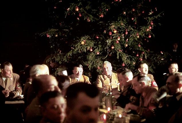 24. Adolf Hitler and other Nazi officials celebrate Christmas at the Lowenbraukeller restaurant in Munich, 1941.