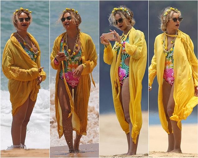 10. She looks both stylish and fun with her lemonade-themed beach look!