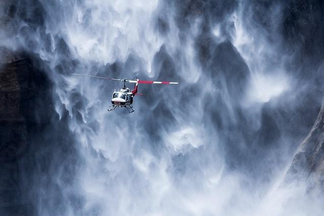 8. A helicopter near Yosemite waterfall, USA