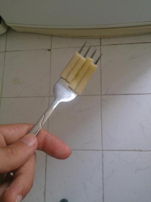 10. Attaching macaroni to a fork.