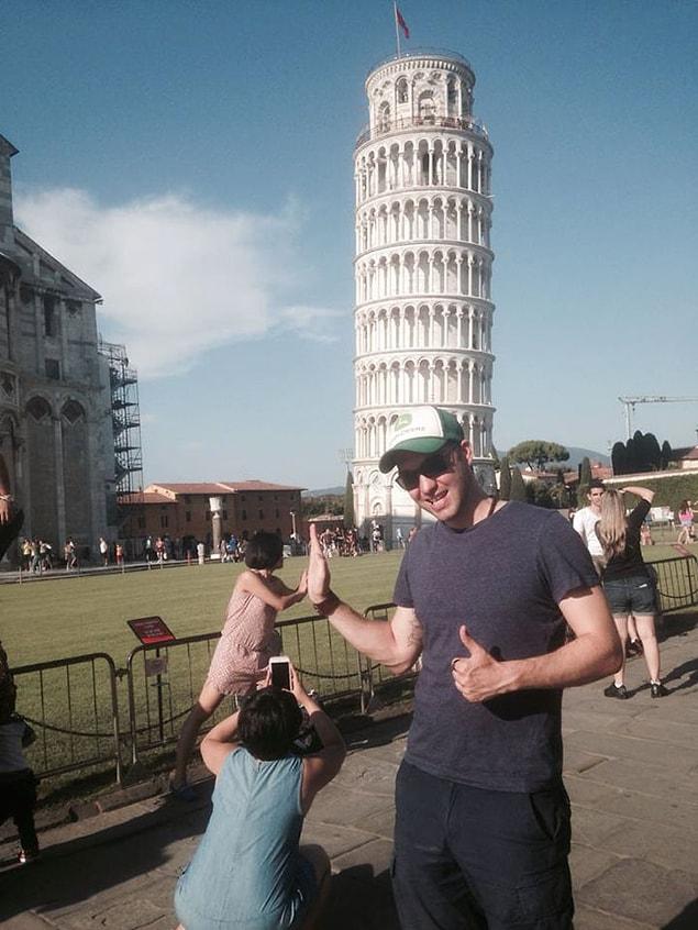 He uploaded a series of photos with the caption “When tourists make better background props than the Leaning Tower of Pisa.”