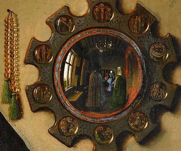 You can spot Jan van Eyck over the reflection in the mirror behind the couple.