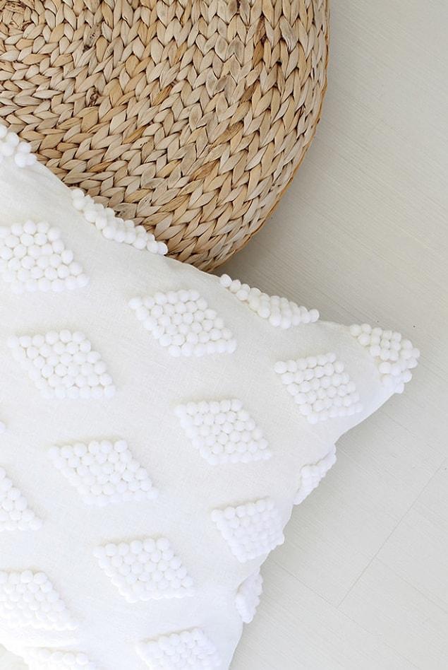 9. Another way you can get away with not changing your lace pillows is pompoms.