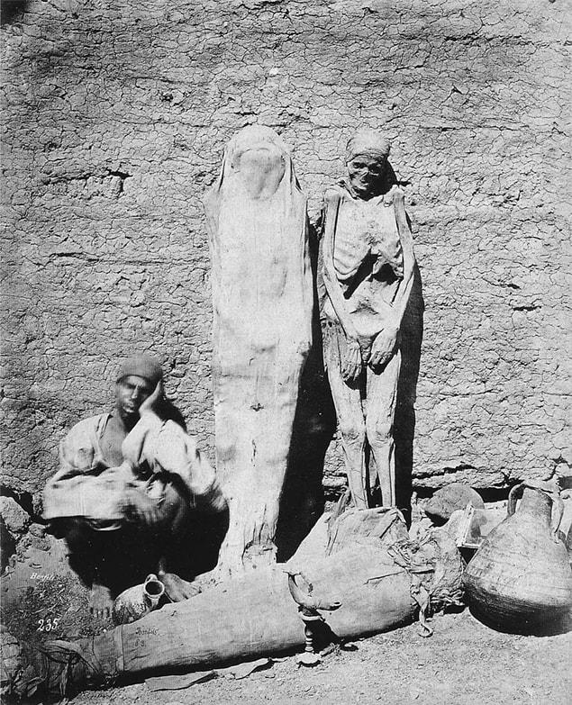 20. Man selling mummies in Egypt, 1875.