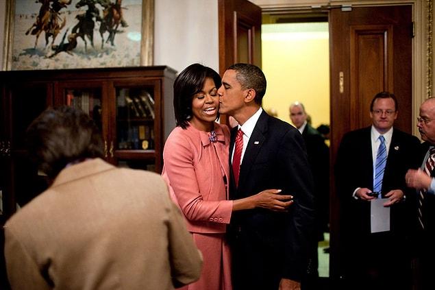 22. Barack kissing Michelle.