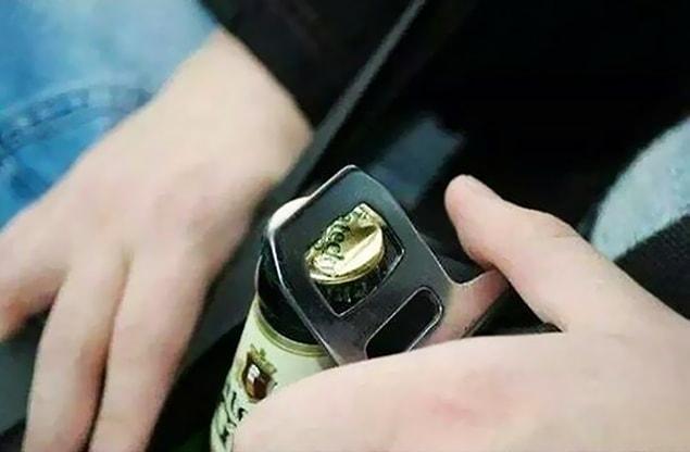 9. Use The Metal Part Of Your Seat Belt To Open Beers While Driving
