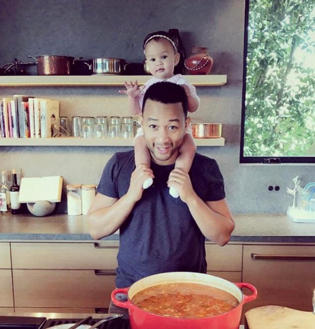 9. John Legend in the kitchen with Luna.