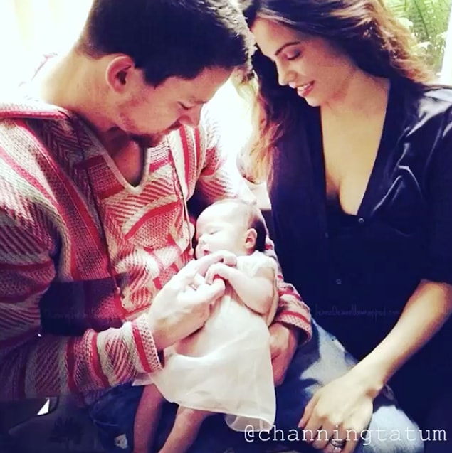 12. And admiring her as a baby with his wife, Jenna.