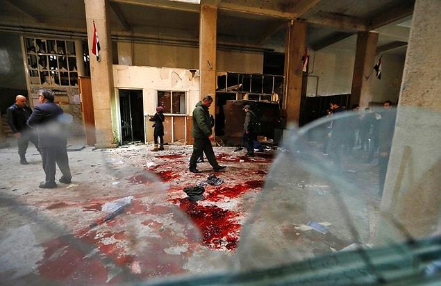 11. Syrian security forces inspect the scene of a reported suicide bombing at the historic Palace of Justice building in Damascus, one of two attacks in the city that left at least 32 dead. The war in Syria is entering its seventh year, with the regime now claiming the upper hand.