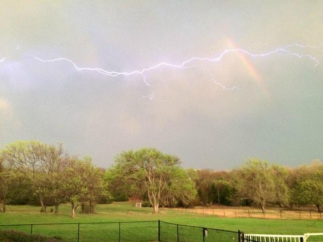 13. A Rainbow And Lightning Seen Together