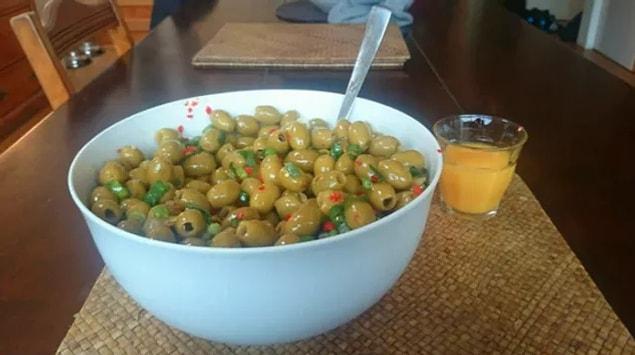 15. Tired of cereal for breakfast? Here's a mega bowl of olives with a side order of fresh orange juice.