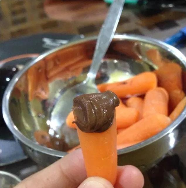 18. Baby carrot dipped in Nutella.