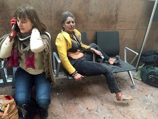 7. Brussels airport attack and two women who are in shock.