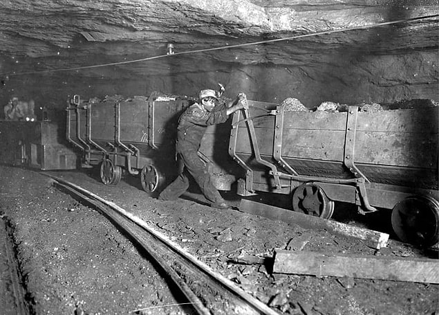 6. In Gary, West Virginia, a boy applies the brakes on a motor train, 1908. He performs this task for about 10 hours a day.