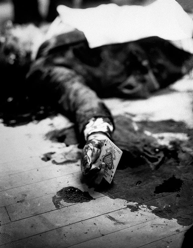 14. The dead body of Mafia leader, Masseria, lies on the floor of a restaurant in Brooklyn with an ace of spades between his fingers. | 1931
