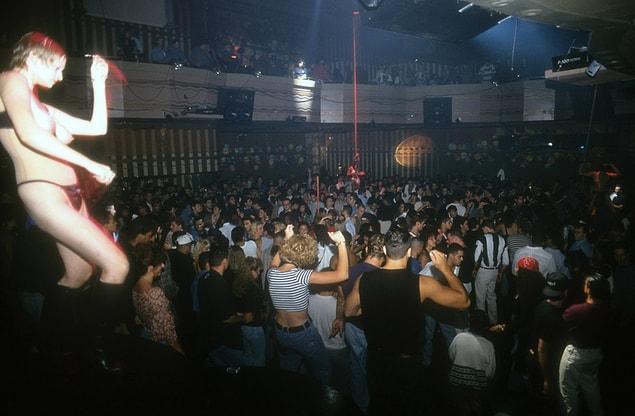3. Woman dancing by the crowd at New York's Webster Hall, 1993.