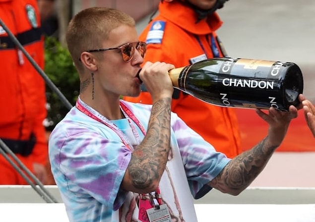 18. Twenty-four bottles of still-water, 24 bottles of alkaline water, energy drinks, vitamin water bottles, cream sodas, assorted juices, fizzy drinks, and protein drinks in JB's green room.