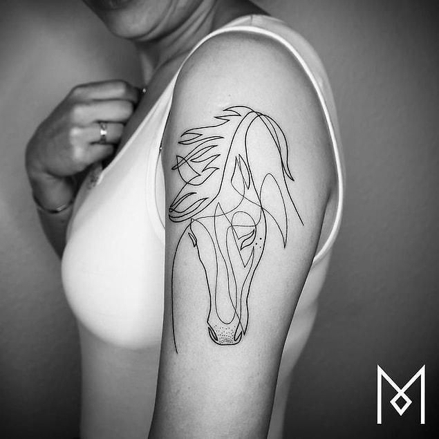 1. Berlin based tattoo artist creates mind-blowing tattoos just by using a single line...