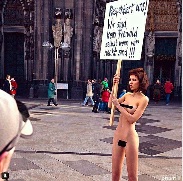 Several months ago, after nearly 1,000 women were sexually assaulted on New Year’s Eve in a train station in Germany, Moiré stood completely nude holding up a sign that read: “Respect Us! We rare not fair game even when naked!!!”