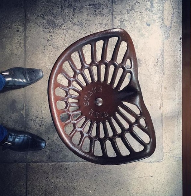 13. When an uncomfortable-looking tractor seat served as a stool.