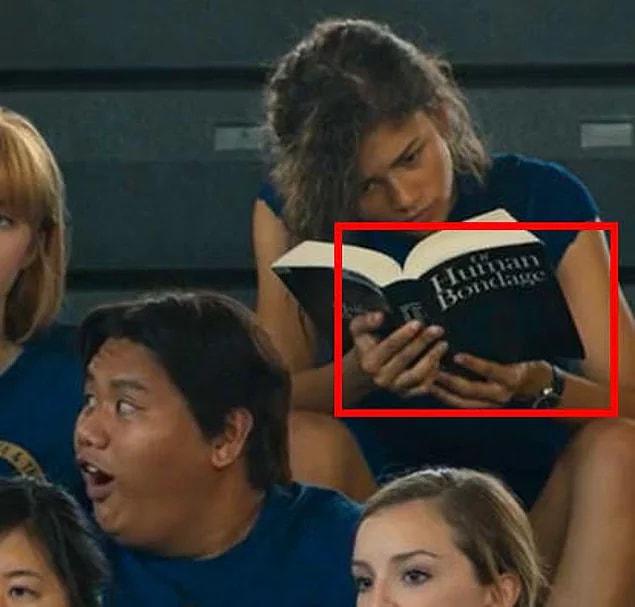 In Spider-Man: Homecoming, Michelle is reading Of Human Bondage. It is a book about an orphan boy who is sent to live with his aunt and uncle.