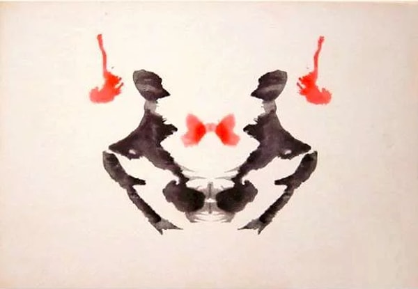 5. В этом чернильном пятне стандартный ИИ (искусственный интеллект) видит пару людей, стоящих напротив друг друга, Норман — человека, выпрыгивающего из окна.