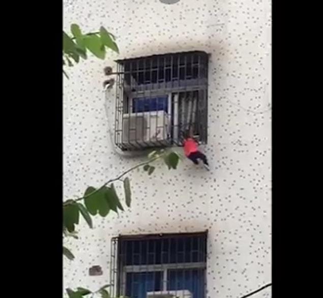 Locals saw the two-year-old boy climb out of the window of his family home in China.