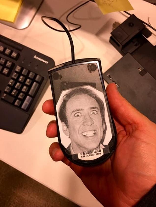 10. This coworker who work (!) overtime to stick a Nicholas Cage picture to the bottom of every computer's mouse: