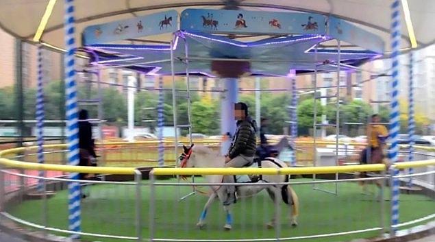 A carousel in China is slammed after it was filmed using real horses on its merry-go-round.