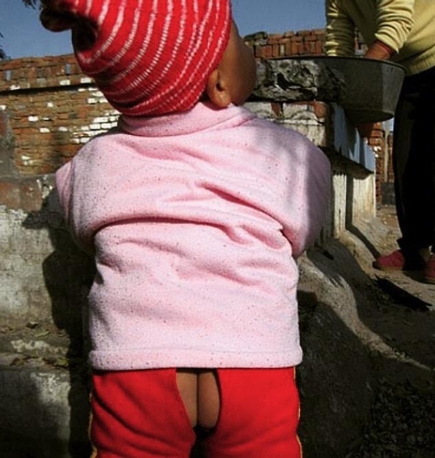 8. Children wear pants with holes to relieve themselves where they want. It's for toilet training.