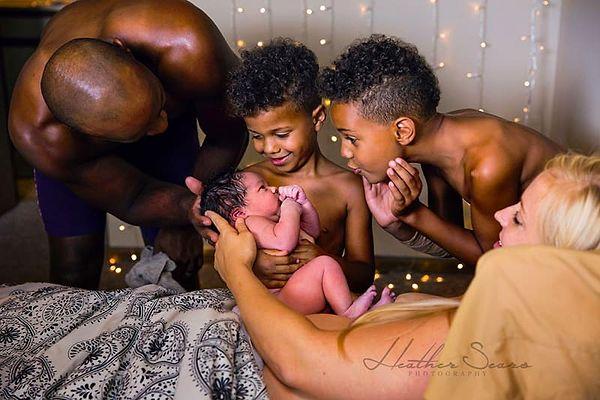 9. Brothers are welcoming their newest member won Member's Choice Best in Category: Postpartum: " Peek-a-boo" by Heather Sears