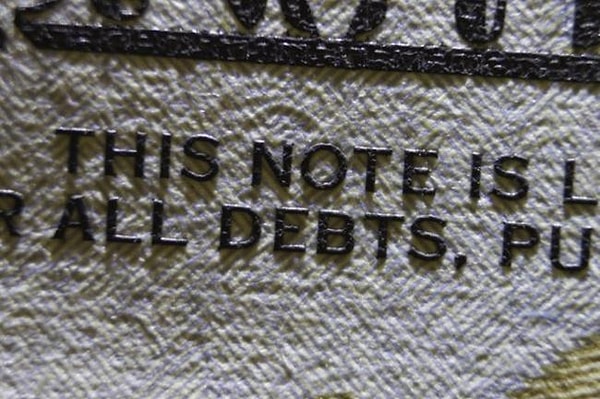 7. Текст на банкноте в $100