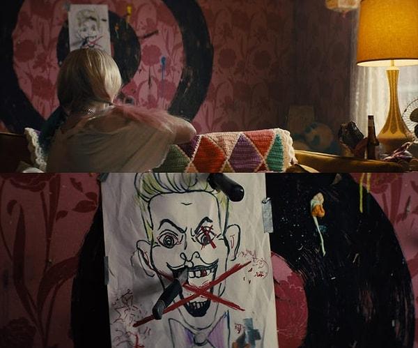15. Bu aslında oldukça bariz ama Harley'nin evinde atış talimi yapmak için kullandığı bir Joker çizimi var.