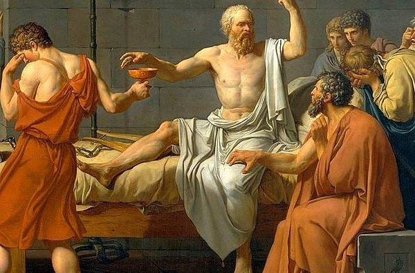 Sokrates'in hemen yanında oturan ve dizini tutan figür ise Sokrates'in öğrencisi Crito.