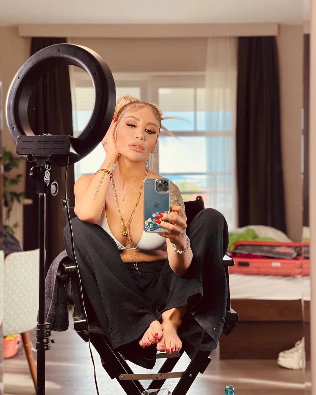 Irem Derici in a revealing outfit her expression confident and bold