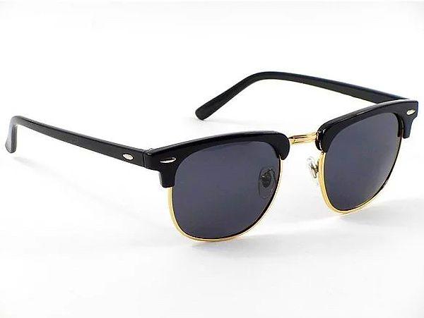 15. Siyah ve altın sarısı detaylı güneş gözlüğü.