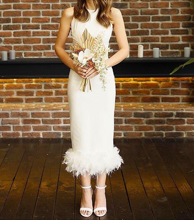 10. Konu evlilikten açılmışken midi boy beyaz otriş detaylı elbise aradığınız nişan kına elbisesi olabilir.