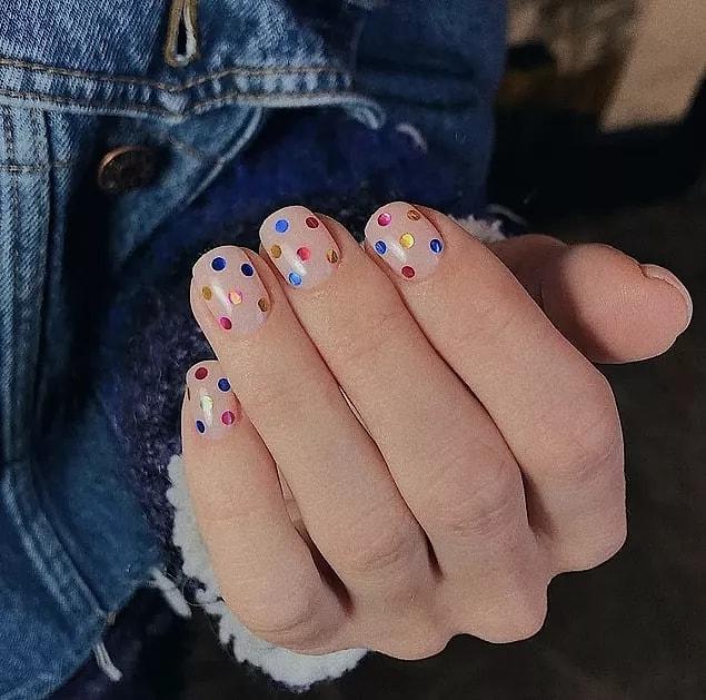 23. A different look at metallic nail polishes: Metallic dots! These fun polka dot nails will make you feel like you're at a party all the time.