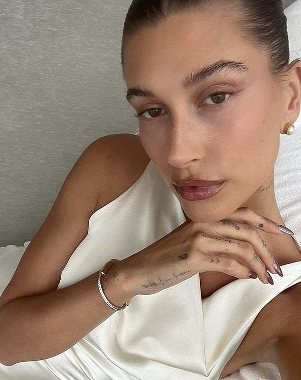 16. To what does Hailey Baldwin Bieber owe her glowing skin?