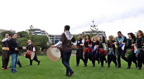 Participants form a circle, holding hands or linking arms, and move in synchrony to the rhythm of traditional musical instruments like the zurna (reed flute) and davul (drum).