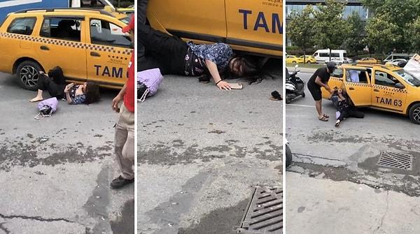 Çıkan tartışma sonucu taksici tarafından araçtan indirilen kadın kendini yere attı, aracın altına girmeye çalıştı.