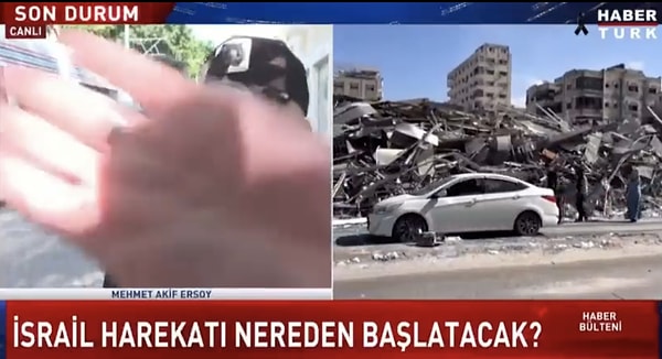 Ardından ise eliyle kamerayı kapatmaya çalıştı.