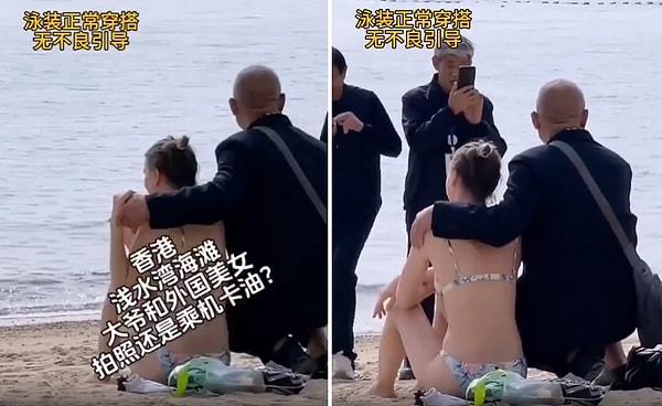 Hong Kong'a tatile geldiği belirtilen bir turistin plajda güneşlendiğini fark ederek yanına giden Çinli erkekler, kadın ile fotoğraf çektirmek isterken ellerini de kadının omzuna koymak istiyorlar.