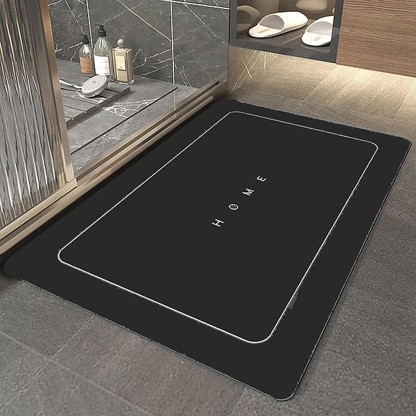 Güvenli kullanım için özel kaymaz tabanlı tasarıma sahip olan şık ve modern görünümlü bir banyo paspası.