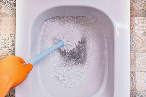 How is toilet cleaning implemented with hydrogen peroxide?